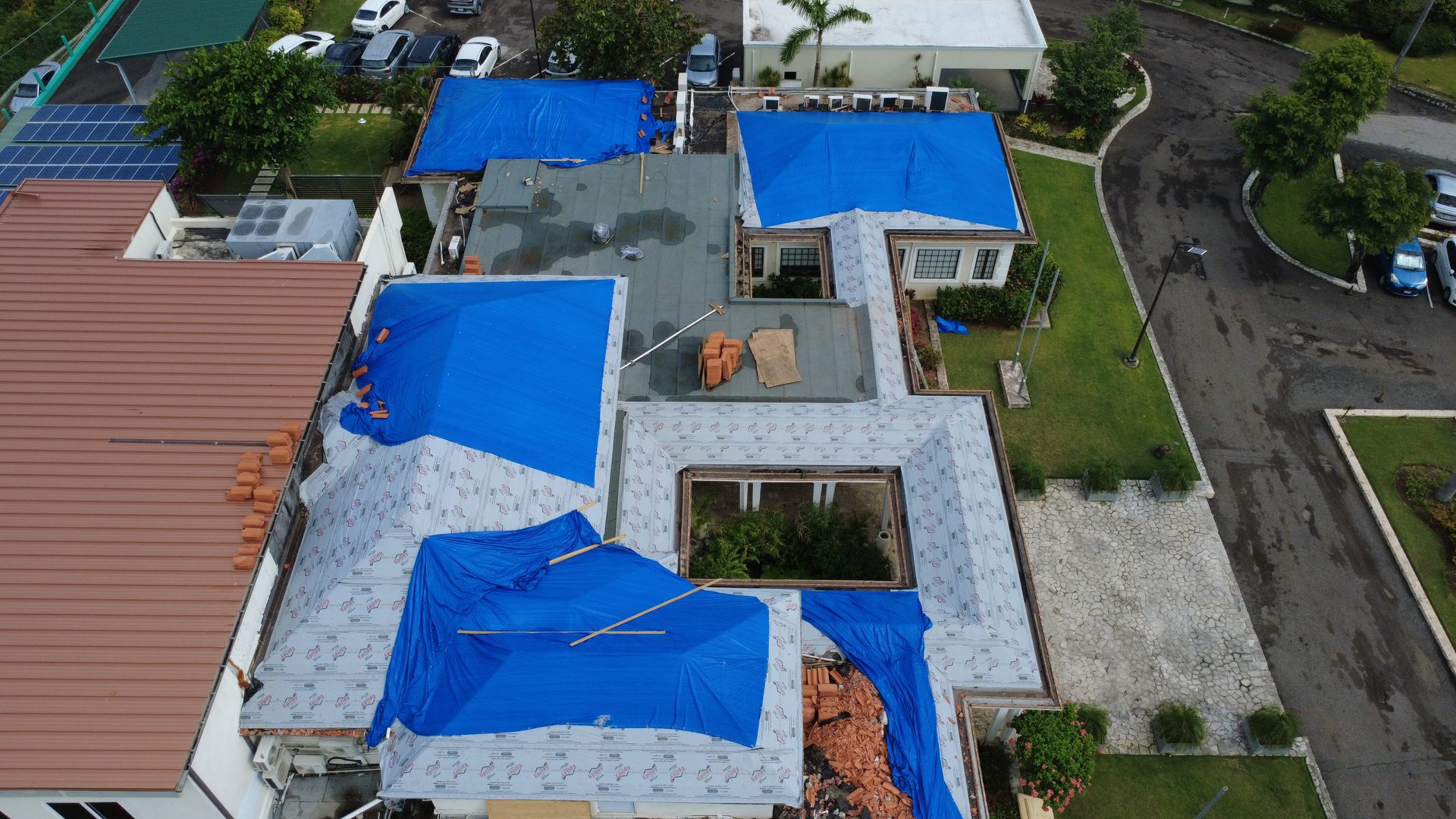 Neighbourhood roof damage after a hurricane in Jamaica