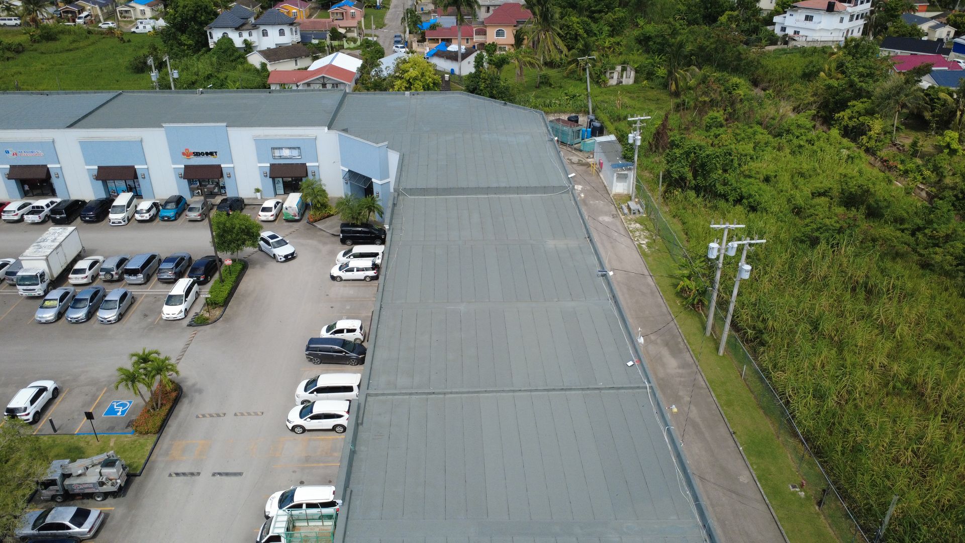 Commercial membrane roof on a plaza in Montego Bay, aerial view